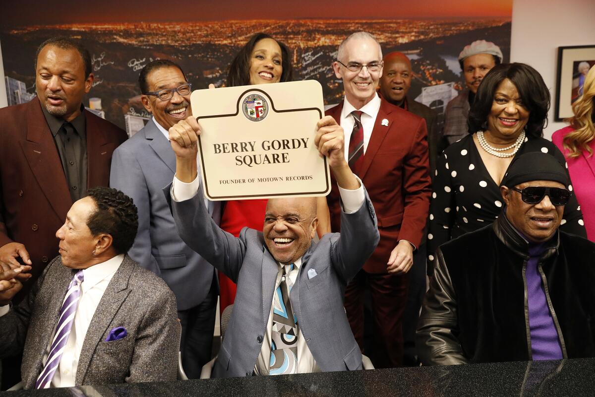 Berry Gordy, center,with Smokey Robinson, left, and Stevie Wonder, right, before a tribute to Gordy by Los Angeles City Councilman Mitch O'Farrell, members of the Motown family and other guests.