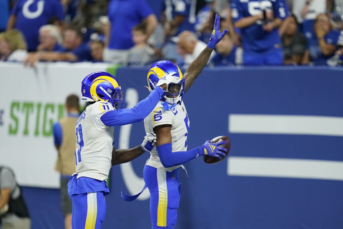 Rams cornerback Jalen Ramsey (5) celebrates his game-clinching interception against the Colts with Darious Williams.