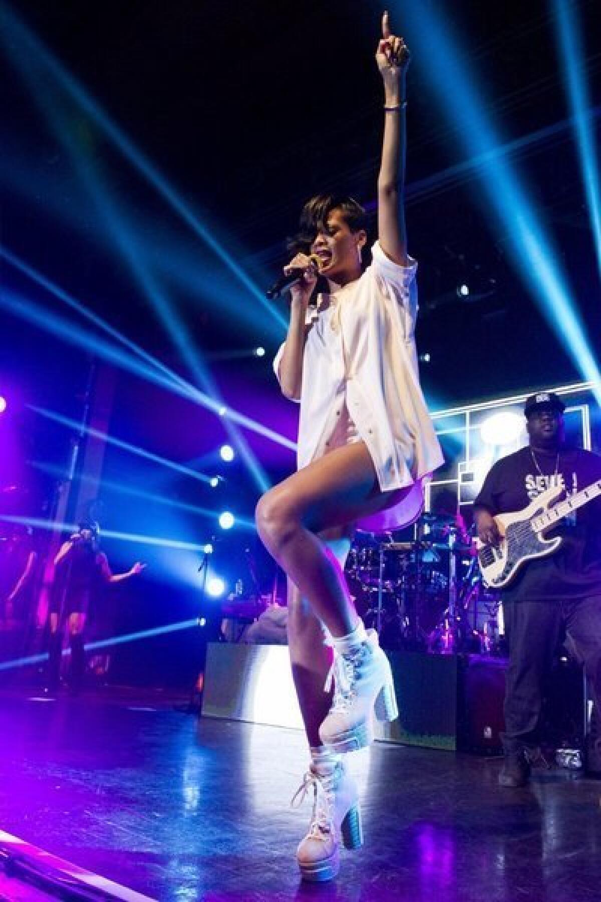 Rihanna performs earlier this month. She'll meet fans at the launch of her new fragrance, Nude by Rihanna.