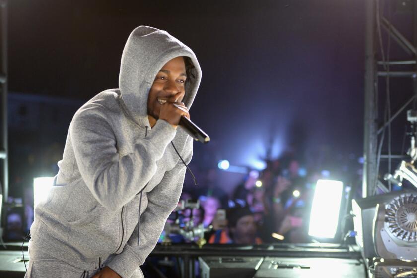 Kendrick Lamar at a March street concert in West Hollywood organized by Reebok. On Monday, the Compton hip-hop artist was commended in the California Senate for his charitable work.