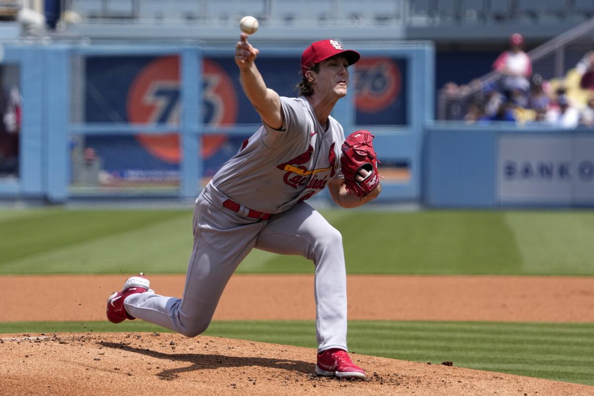 St. Louis Cardinals starting pitcher Jake Woodford delivers in the first inning.