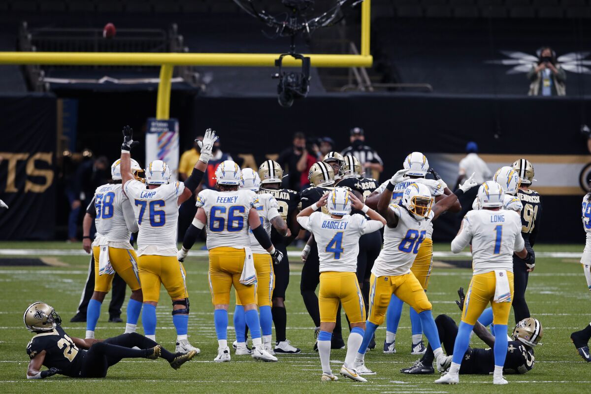 Chargers kicker Michael Badgley (4) reacts after missing late field goal Monday that would have won game.