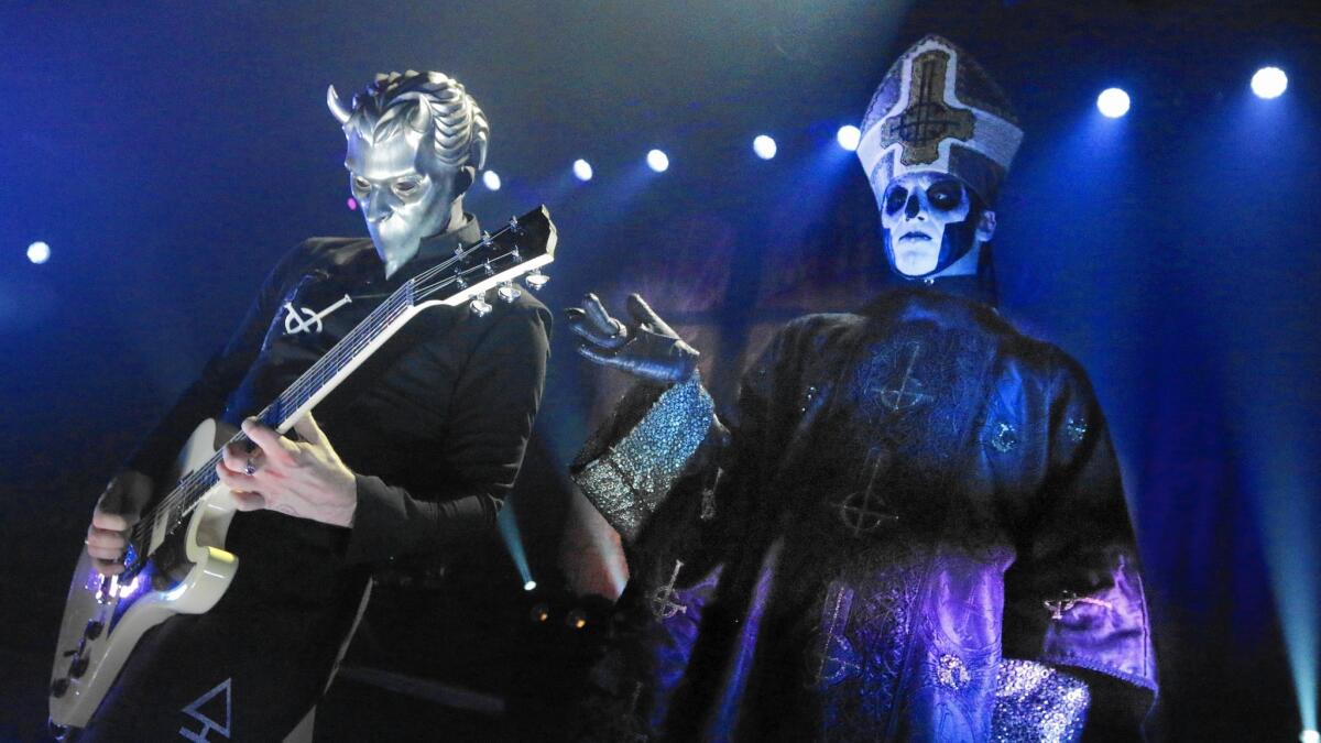 Papa Emeritus III, right and one of the Nameless Ghouls of Ghost, Swedish heavy metal band at the Mayan Theatre in Los Angeles.