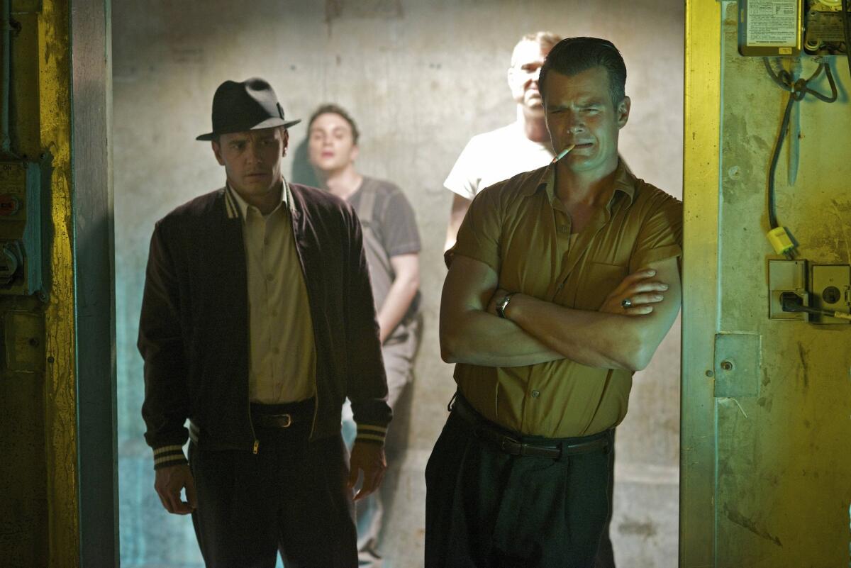 This image released by Hulu shows James Franco as Jake Epping, left, and Josh Duhamel as Frank Dunning in a scene from the eight-part series, "11.22.63," streaming on Hulu beginning Monday, Feb. 15, 2016.