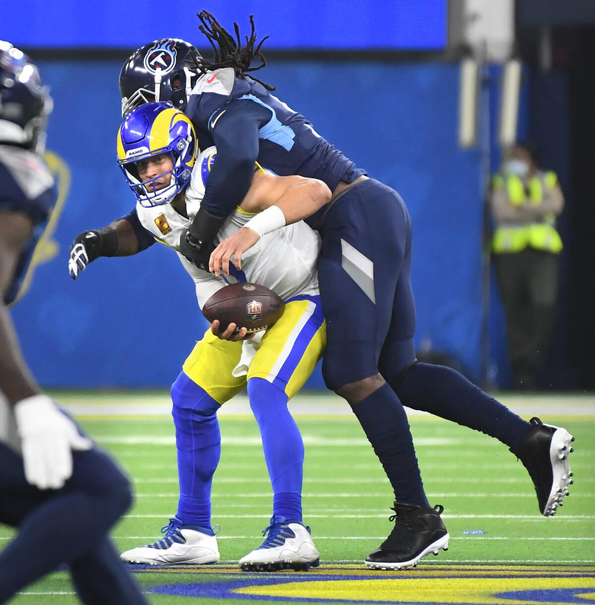 Rams quarterback Matthew Stafford is sacked by Titans Denico Autry in the first quarter.