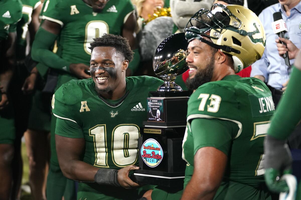 Brown tosses 3 TD passes to lead USF to a 45-0 rout of undermanned