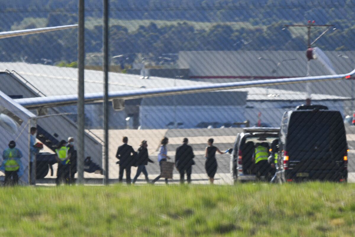Passengers, including British-Australian academic Kylie Moore-Gilbert, disembark from an Australian Government jet.