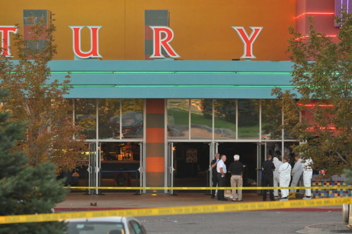 Crime scene tape blocks off the Century 16 movie theater in Aurora, Colo., where a gunmen attacked patrons during an early morning screening of the new Batman movie, "The Dark Knight Rises."