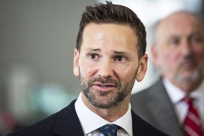 FILE - In this March 6, 2019 file photo, former U.S. Rep. Aaron Schock, R-Ill., speaks to reporters at the Dirksen Federal Courthouse in Chicago. On Thursday, March 5, 2020, Schock came out as gay in social media and web posts, saying he would do more if he were in Congress today to support LGBTQ rights _ which he opposed when he served. (Ashlee Rezin/Chicago Sun-Times via AP)