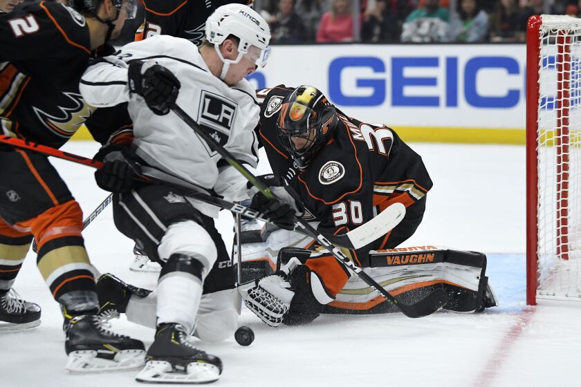 Los Angeles Kings center Jaret Anderson-Dolan, left, tries to get a shot past Anaheim Ducks goaltender Ryan Miller during the first period of a preseason NHL hockey game Wednesday, Sept. 25, 2019, in Anaheim, Calif. (AP Photo/Mark J. Terrill)