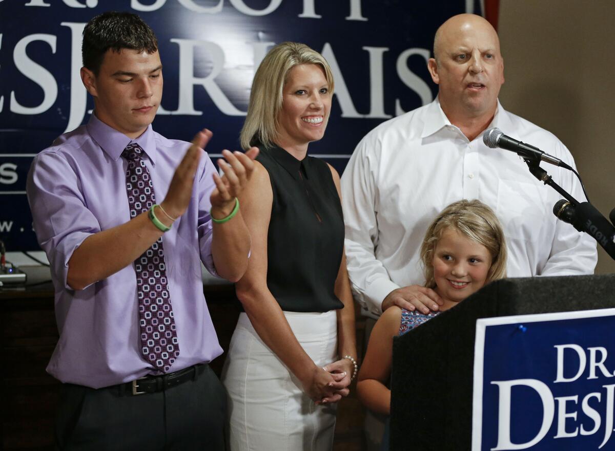 Rep. Scott DesJarlais (R-Tenn.), right, speaks to supporters in South Pittsburg, Tenn. With him are his wife, Amy, his stepson, Tyler Privette, left, and daughter, Maggie, 7.