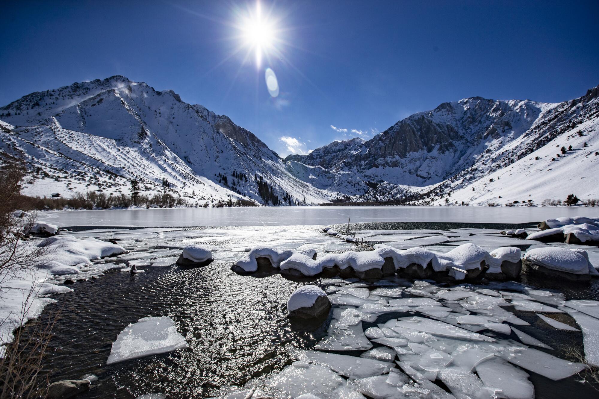 Ice breaks up at the mouth of Convict Creek overlooking Convict Lake and the Sierra Nevada range near Mammoth Lakes.
