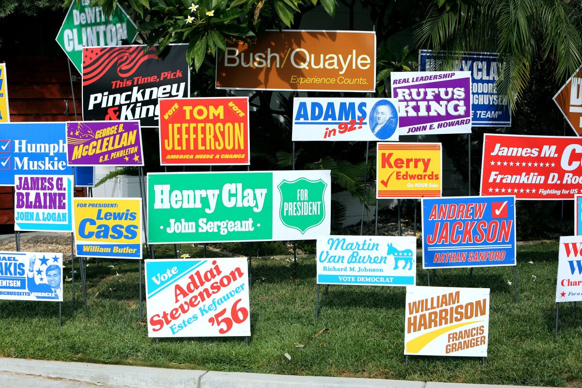 A lawn features election signs of all colors for failed candidates like John Kerry and Martin Van Buren
