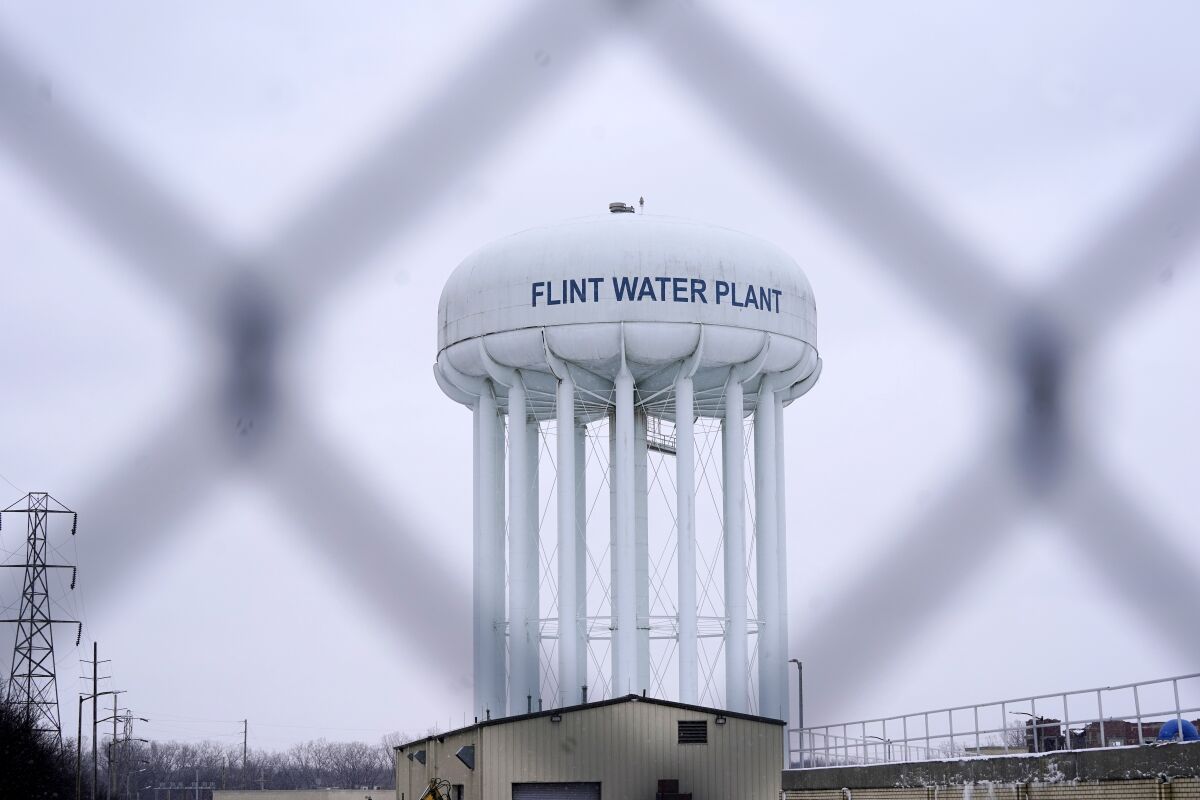 FILE - The Flint water plant tower is seen, Thursday, Jan. 6, 2022, in Flint, Mich. A judge awarded about $40 million Friday, Feb. 4, 2022, to the lead attorneys in a $626 million settlement for Flint residents and property owners whose water was contaminated with lead, but millions in additional legal fees will also be carved out as claimants get paid. (AP Photo/Carlos Osorio, File)