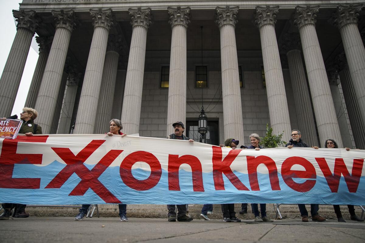Activists rallied for accountability for fossil fuel companies outside of New York Supreme Court in New York City. 
