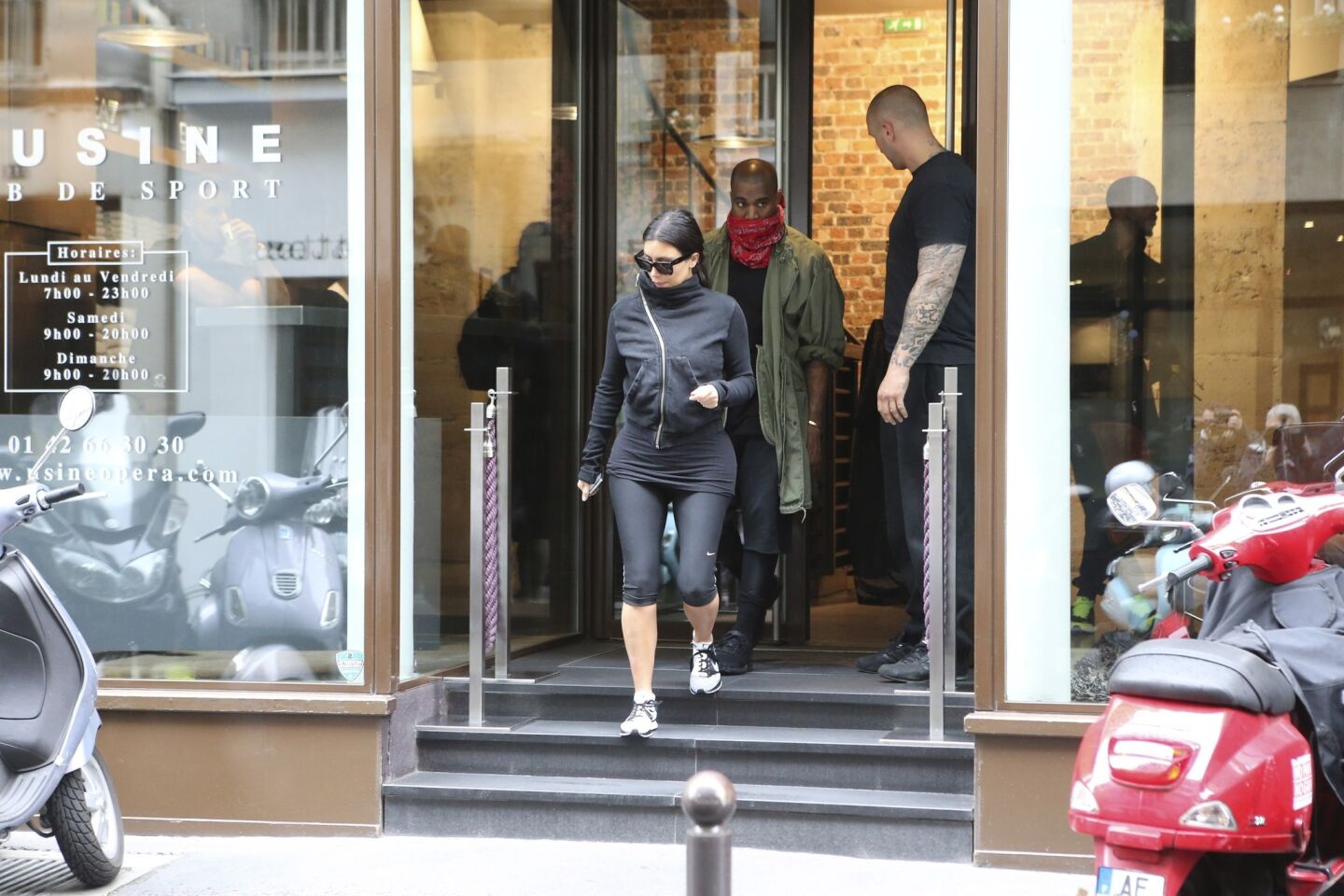 Kim Kardashian and Kanye West leave a fitness center in Paris on May 21.