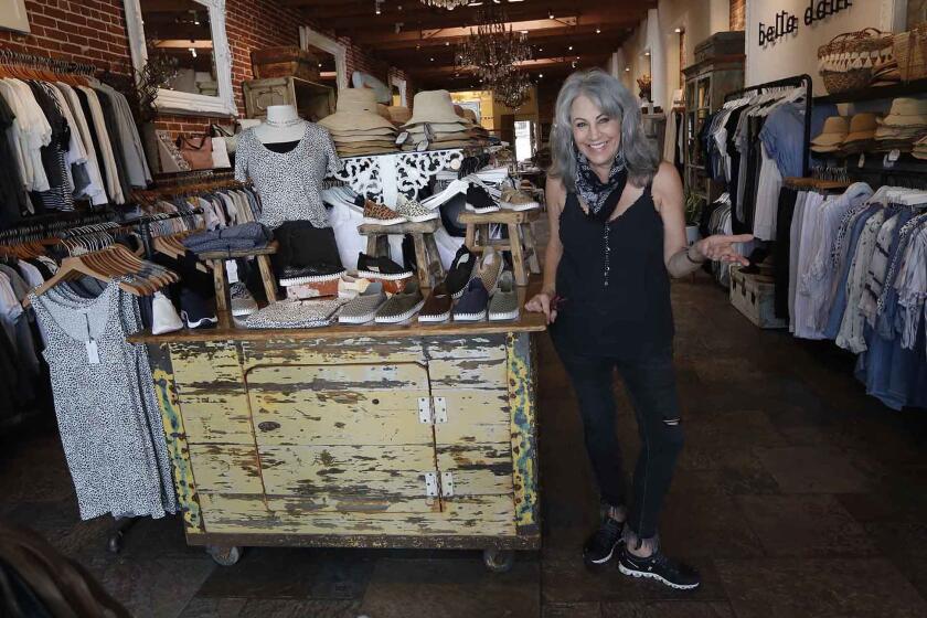 Deanna Frieze is happy to open her doors at Sunny Days in Laguna Beach, as Phase 2 of reopening business in California began on Friday.