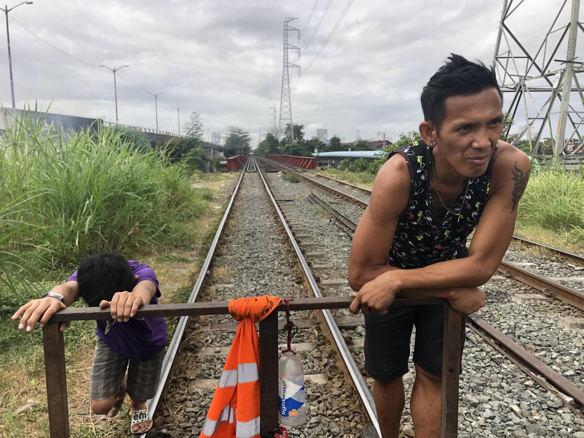 Alfred "Betong" Mendez runs a trolley in Manila. For about 40 cents, anyone can climb on and cross the Pasig River from the Santa Mesa district to the metro area of Manila.