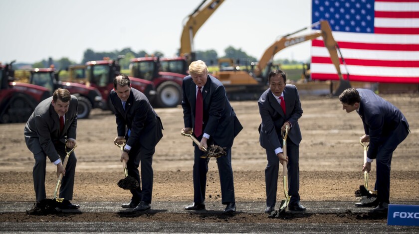 From left to right, Christopher Tank Murdock, the first Wisconsin Foxconn employee, Wisconsin Gov. Scott Walker, President Donald Trump, Foxconn chairman Terry Gou and House Speaker Paul Ryan at a groundbreaking for the Foxconn plant Thursday, June 28, 2018 in Mt. Pleasant, Wis. Foxconn plans to open facilities in west-central Wisconsin.