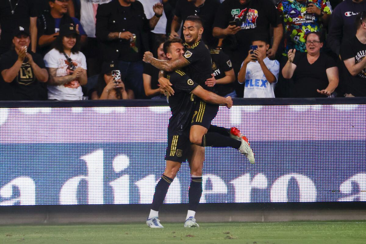 LAFC forward Daniel Musovski celebrates his goal with Cristian Arango.