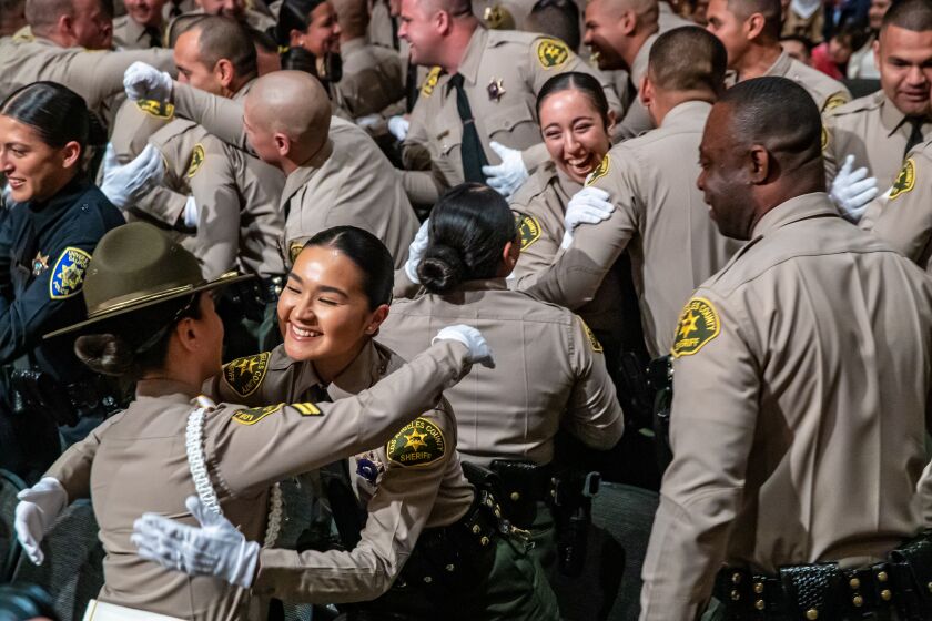 Los Angeles, CA - March 03: Los Angeles County Sheriff Academy Class 464 celebrate successfully graduating at a ceremony held at East Los Angeles College on Friday, March 3, 2023 in Los Angeles, CA. (Irfan Khan / Los Angeles Times)