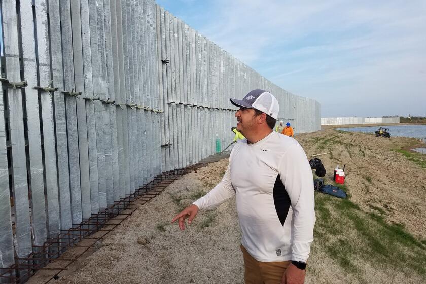 Tommy Fisher, president and CEo of Tempe, Ariz.-based Fisher Industries, surveyed border fencing Tuesday that he's building on private land in south Texas.