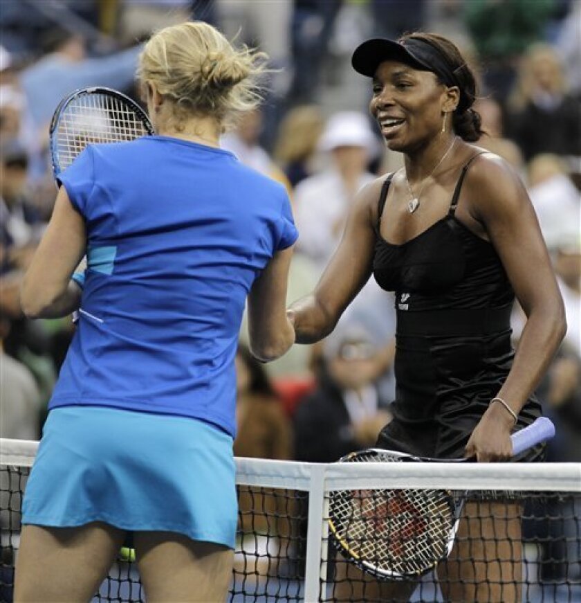 Kim Clijsters, left, of Belgium shakes hands with Venus Williams of the United States after beating her 4-6, 7-6(2), 6-4 in the semifinal round of play at the U.S. Open tennis tournament in New York, Friday, Sept. 10, 2010. (AP Photo/Darron Cummings)