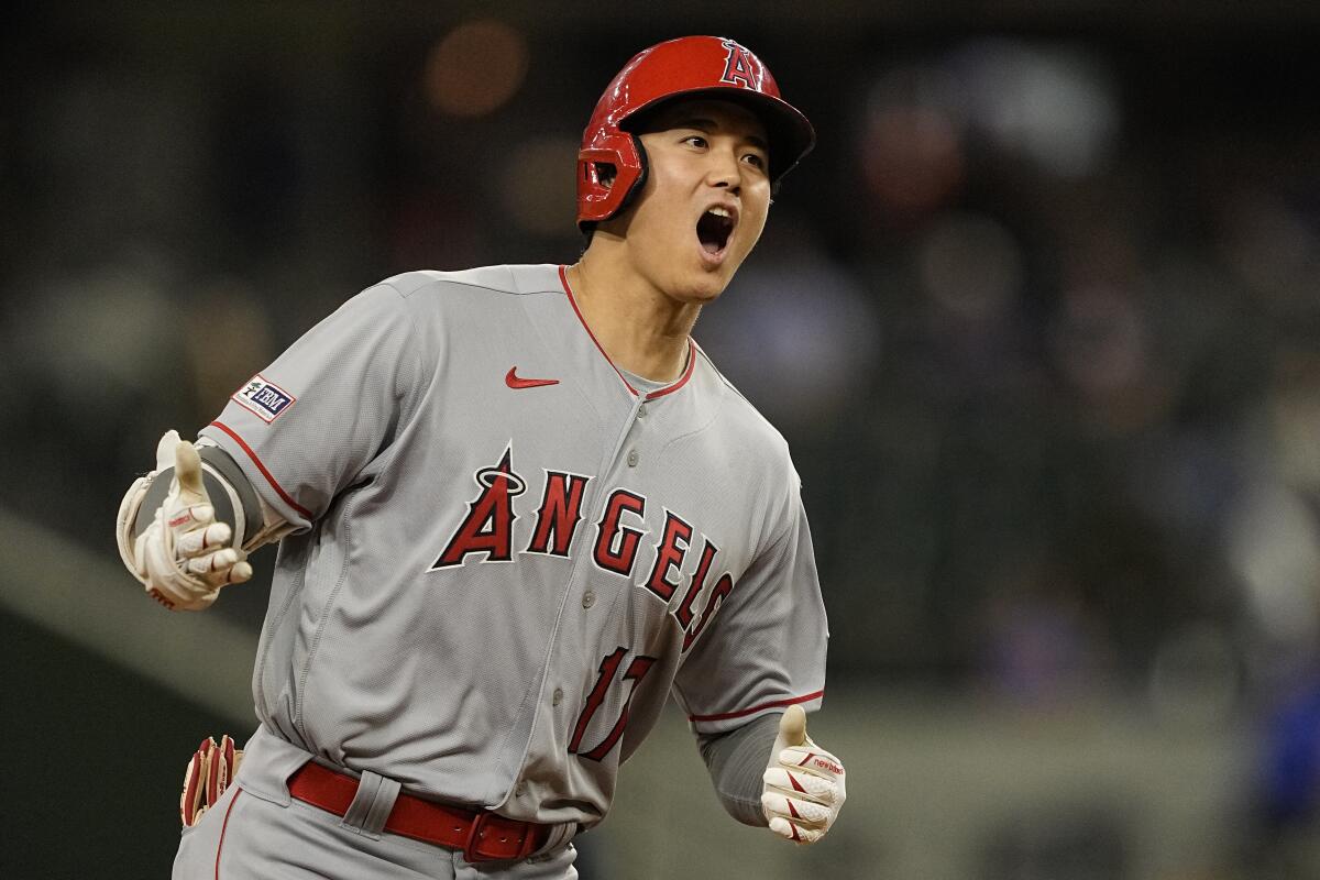 The Angels' Shohei Ohtani runs the bases after hitting a two-run home run during the 12th inning against the Texas Rangers.