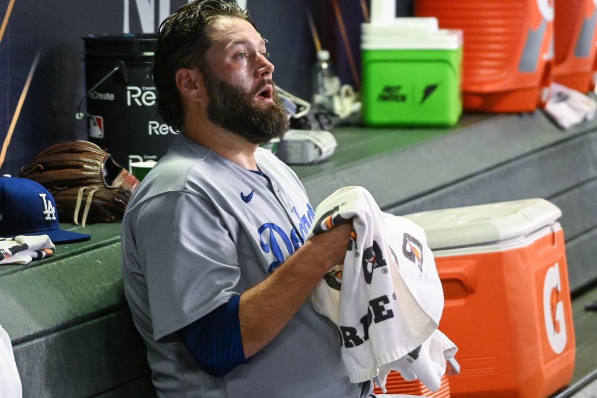Dodgers starting pitcher Lance Lynn sits in the dugout after being taken out of Game 3 of the NLDS.