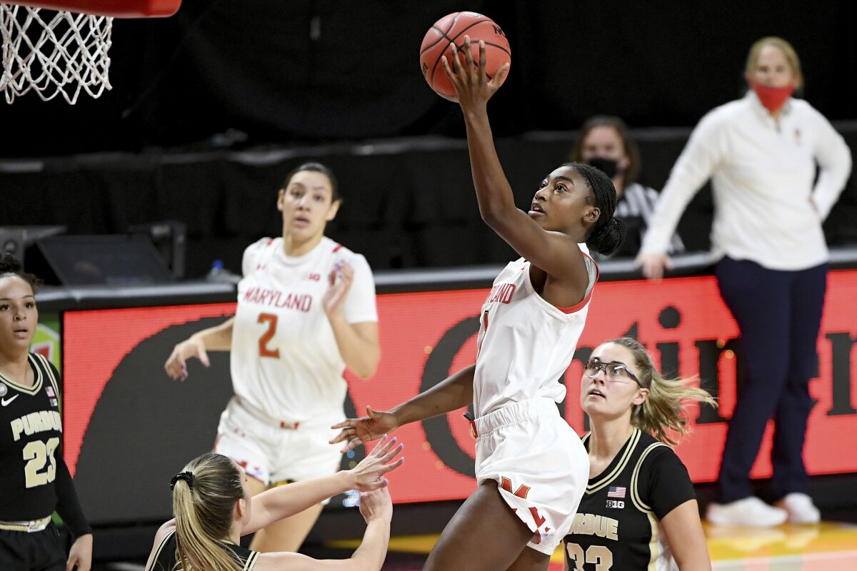 Maryland guard Diamond Miller (1) shoots in front of Purdue defenders during the second half of an NCAA college basketball game, Sunday, Jan. 10, 2021, in College Park, Md. (AP Photo/Will Newton)
