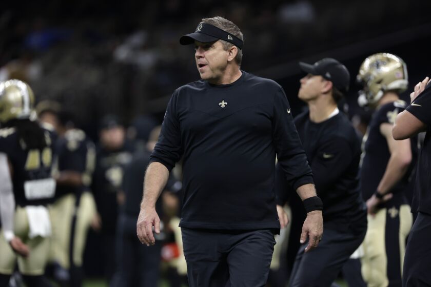 FILE - New Orleans Saints head coach Sean Payton walks on the field before an NFL football game against the Carolina Panthers in New Orleans, Jan. 2, 2022. The Carolina Panthers have received permission from the New Orleans Saints to interview Sean Payton for their vacant head coaching position, according to a person familiar with the situation. (AP Photo/Derick Hingle, File)