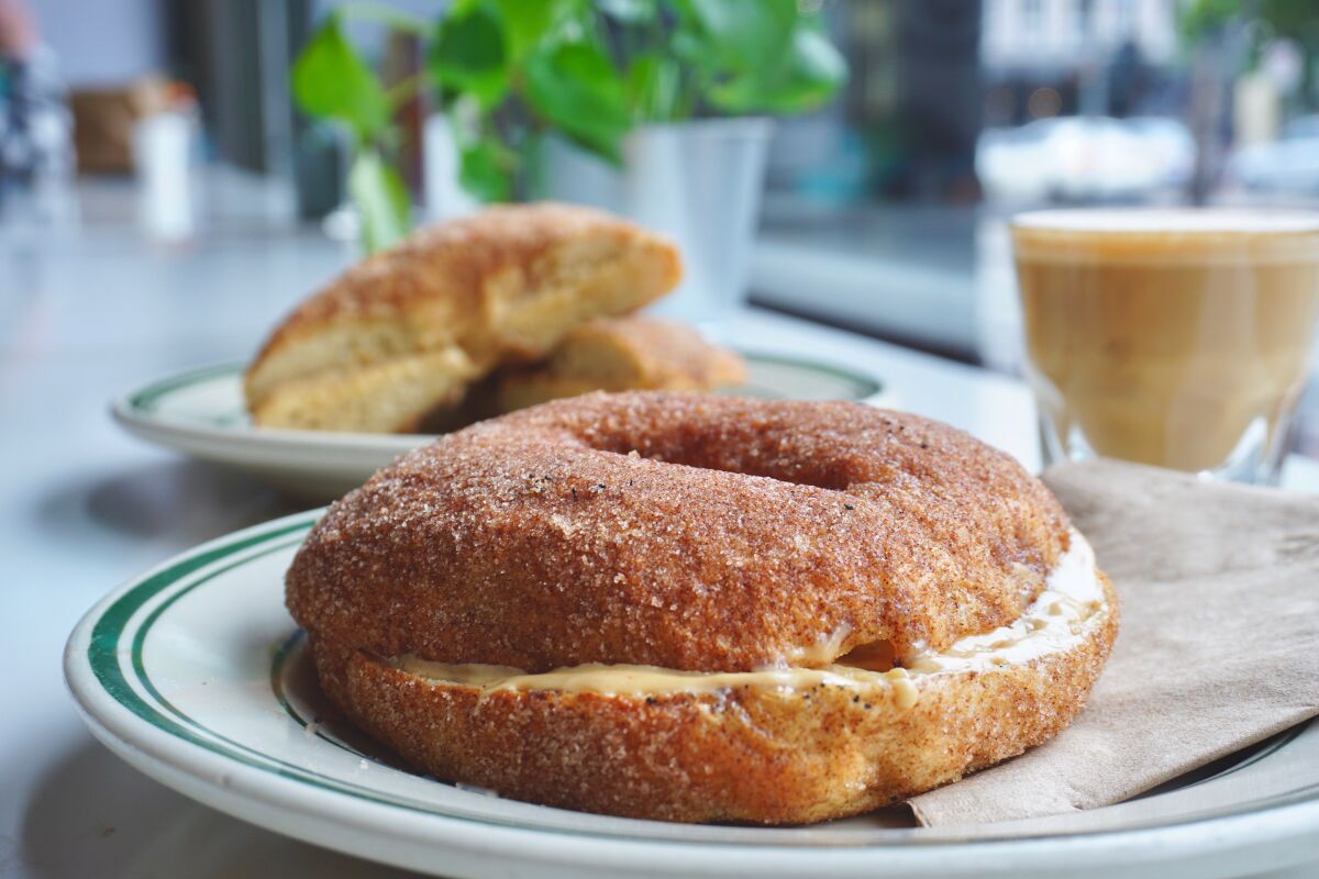 Through May 31, churro bagels with dulce de leche cream cheese are on the menu at Spill the Beans coffeehouse in the Gaslamp Quarter.