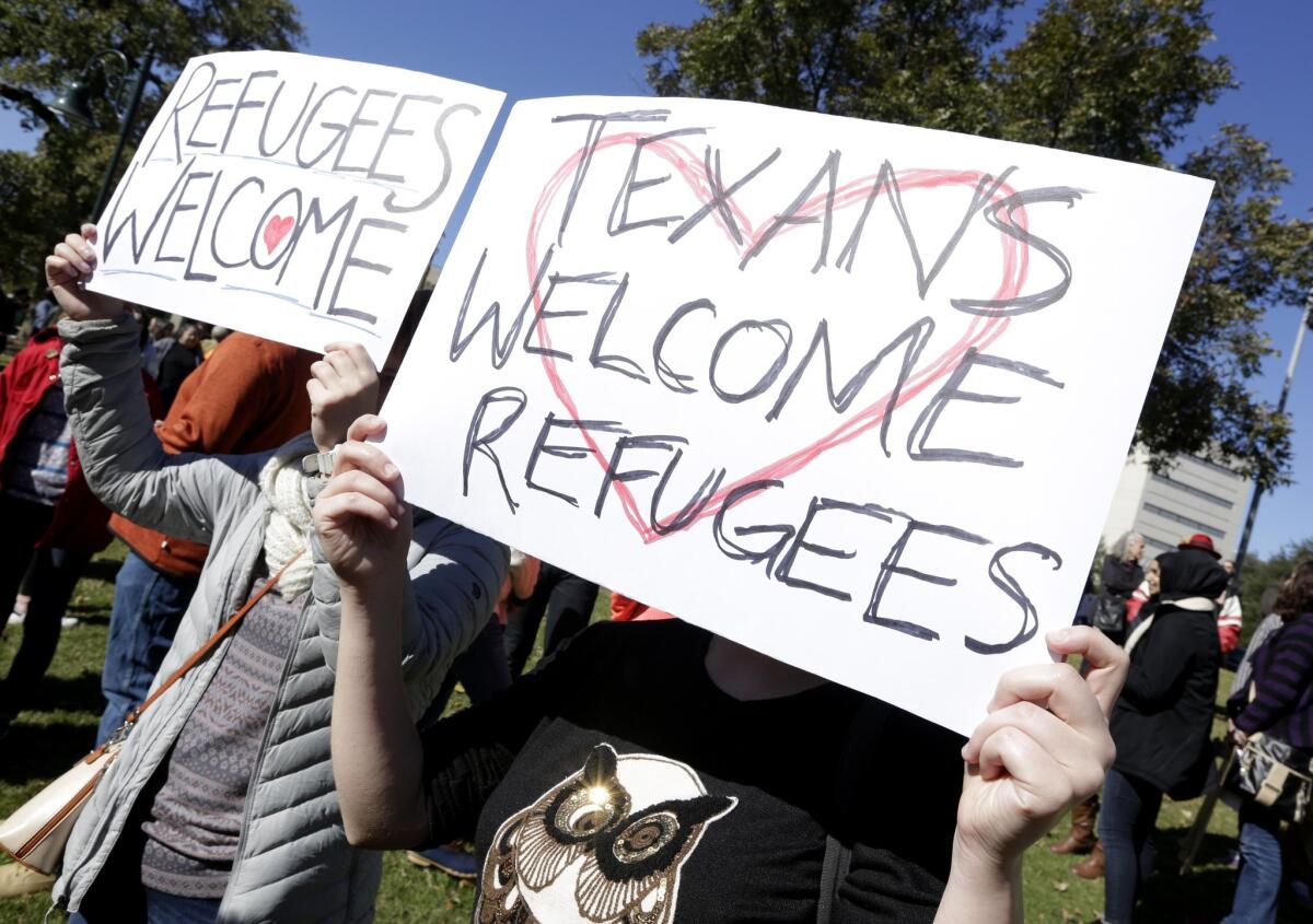 Members of the Syrian People Solidarity Group demonstrate on Nov. 22 in Austin, Texas. The group protested comments by Texas Gov. Greg Abbott, who said he did not want Syrian refugees settling in the state.