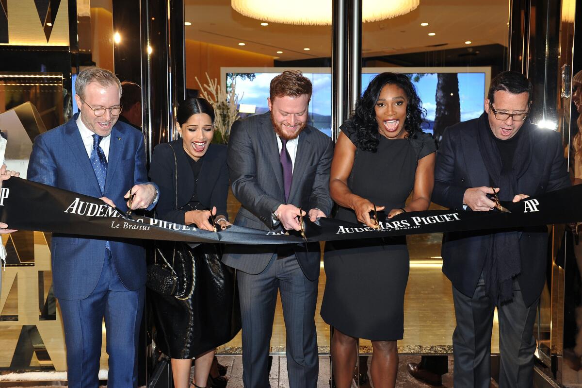 From left, Audemars Piguet North America CEO Xavier Nolot, actress Freida Pinto, Westime President Greg Simonian, tennis star Serena Williams and Audemars Piguet global CEO Francois-Henry Bennahmias cut the ribbon at the new Rodeo Drive boutique on Dec. 9, 2015.