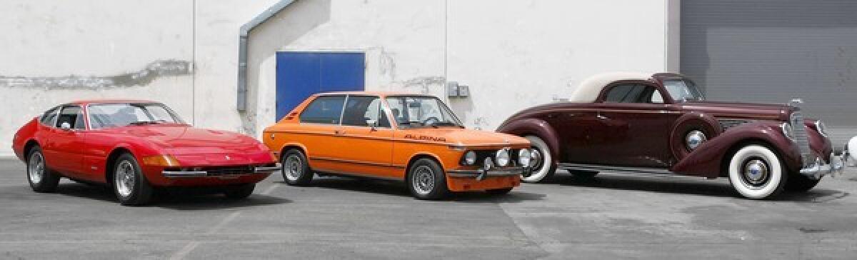 Auctions America will auction off more than 400 classic collectibles including, (left to right) this Ferrari, BMW and Lincoln, which are temporarily stored at a warehouse in Van Nuys on Friday, July 26, 2013. The auction will be held in Burbank next Thursday, Aug. 1.