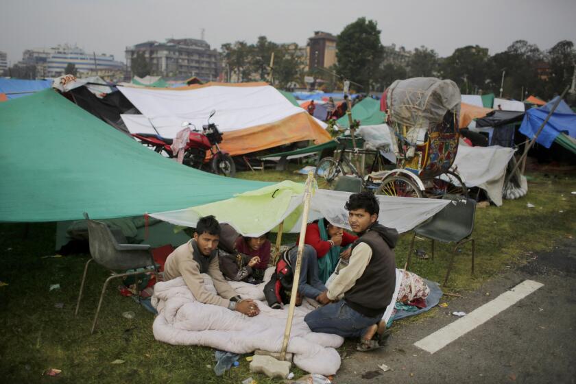 Survivors of Saturday's earthquake wake up Tuesday after sleeping outside over fears of aftershocks in Kathmandu, Nepal. More than 3,700 have died in the quake.