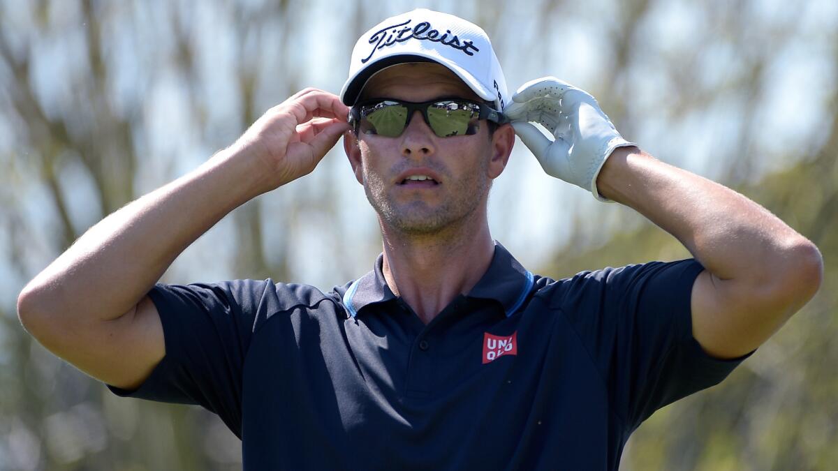 Adam Scott adjusts his sunglasses before teeing off on the 10th hole during the third round of the Arnold Palmer Invitational in Orlando, Fla., on March 21.