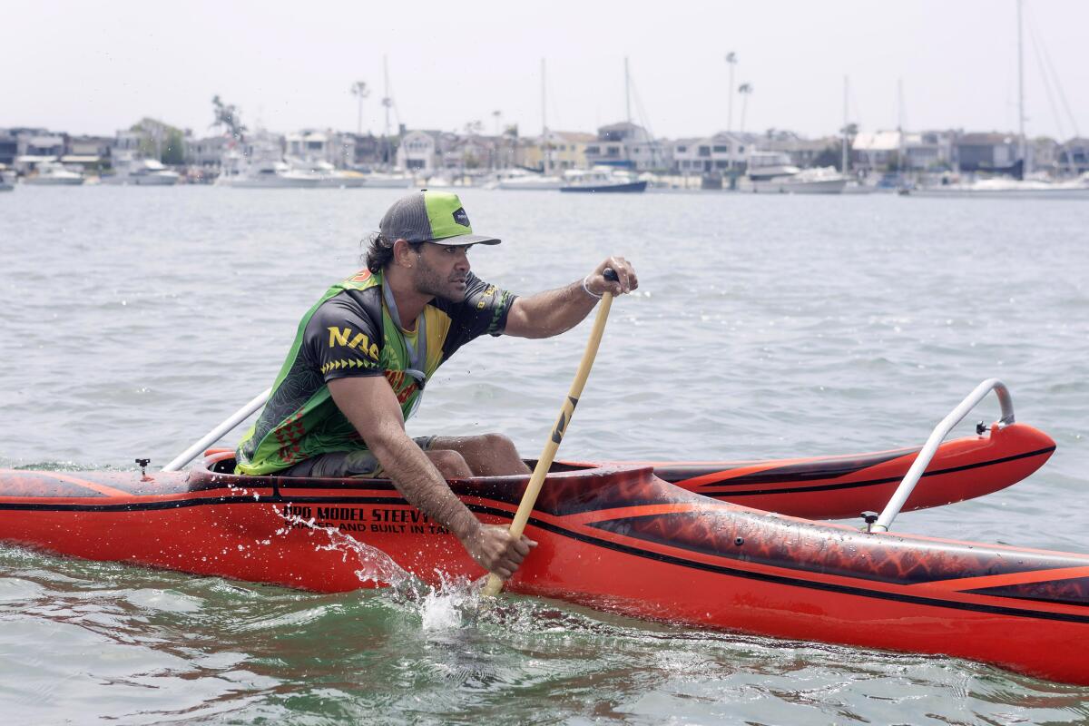 Steeve Teihotaata of Tahiti leads in Va'a California's Long Beach to Newport Harbor race.