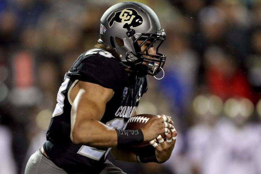 BOULDER, CO - SEPTEMBER 23: Phillip Lindsay #23 of the Colorado Buffaloes carries the ball against the Washington Huskies at Folsom Field on September 23, 2017 in Boulder, Colorado. (Photo by Matthew Stockman/Getty Images) ** OUTS - ELSENT, FPG, CM - OUTS * NM, PH, VA if sourced by CT, LA or MoD **