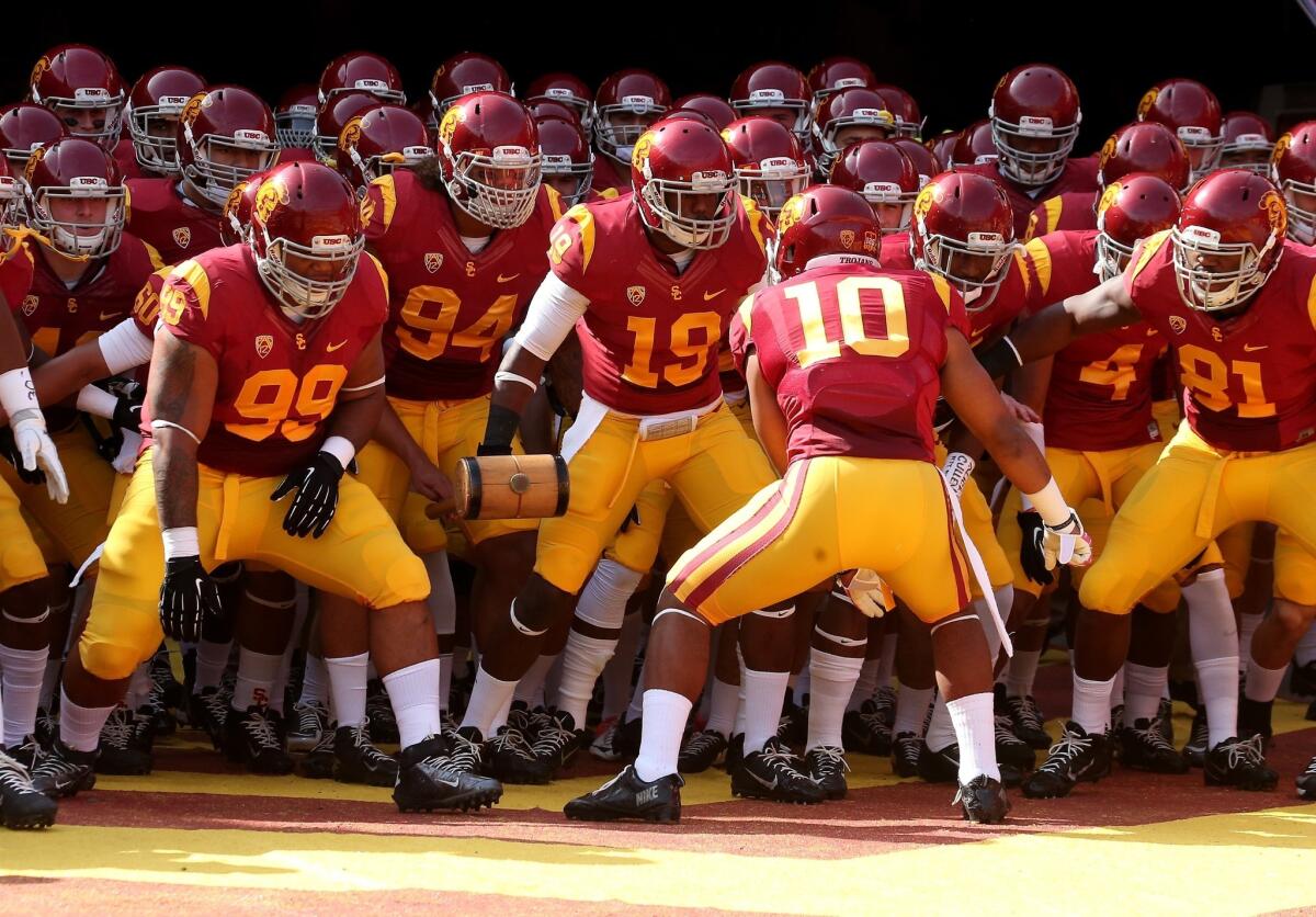 USC players prepare to take the field prior to the start of Saturday's game against Utah. The Trojans are doing everything they can to be ready for the hostile environment that awaits them in Corvallis, Ore., on Friday.