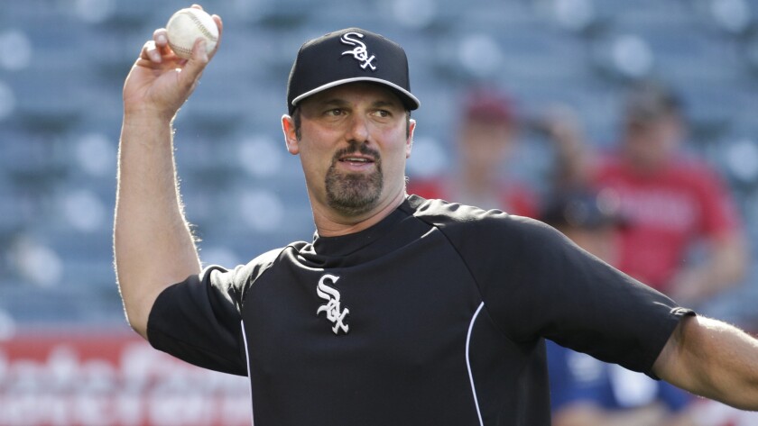 Chicago White Sox first baseman Paul Konerko throws a ball before Friday's game against the Angels. Konerko has come a long way since making his major league debut with the Dodgers in 1997.