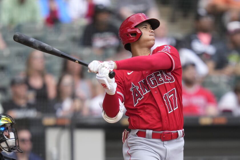 Los Angeles Angels' Shohei Ohtani watches his second, two-run home run of the game off Chicago White Sox starting pitcher Lance Lynn during the fourth inning of a baseball game Wednesday, May 31, 2023, in Chicago. (AP Photo/Charles Rex Arbogast)