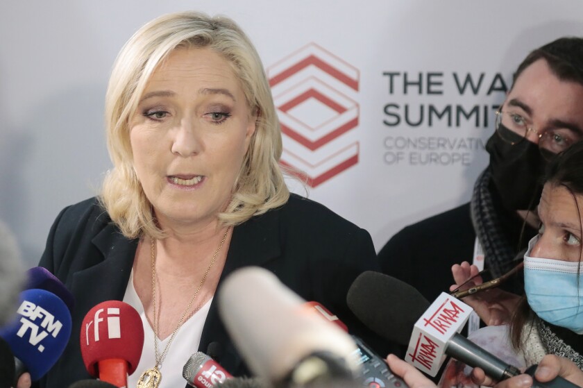 The French far-right party leader Marine Le Pen attends a press conference with reporters in Warsaw, Poland, Saturday, Dec. 4, 2021. The leaders of right-wing populist parties met to discuss how they can work together to bring change to the European Union, which they accuse of acting like a super-state that is eroding the traditions and powers of the EU's 27 member nations. (AP Photo)