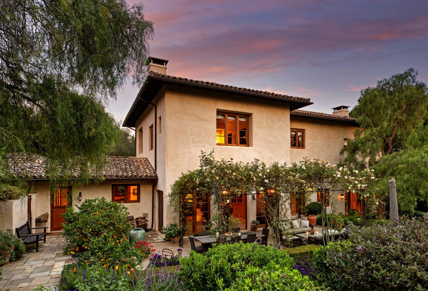 The exterior of the Montecito home with a patio area