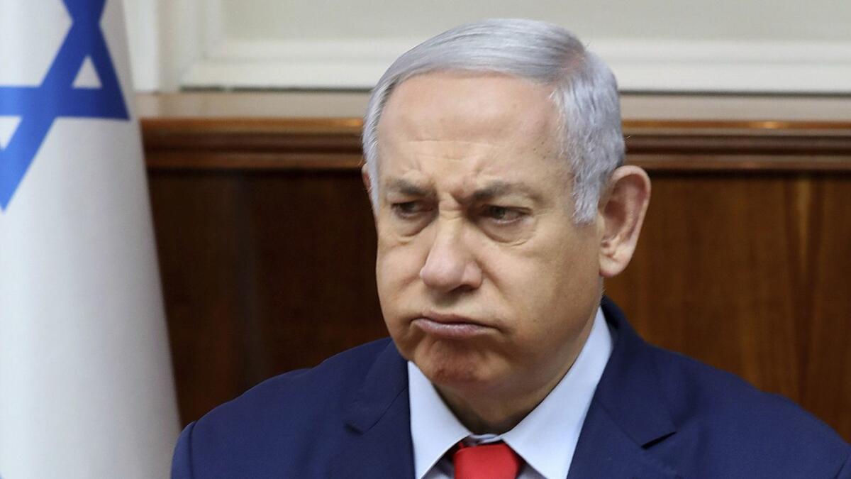 Israeli Prime Minister Benjamin Netanyahu reacts at the start of a Cabinet meeting at his Jerusalem office on May 12.