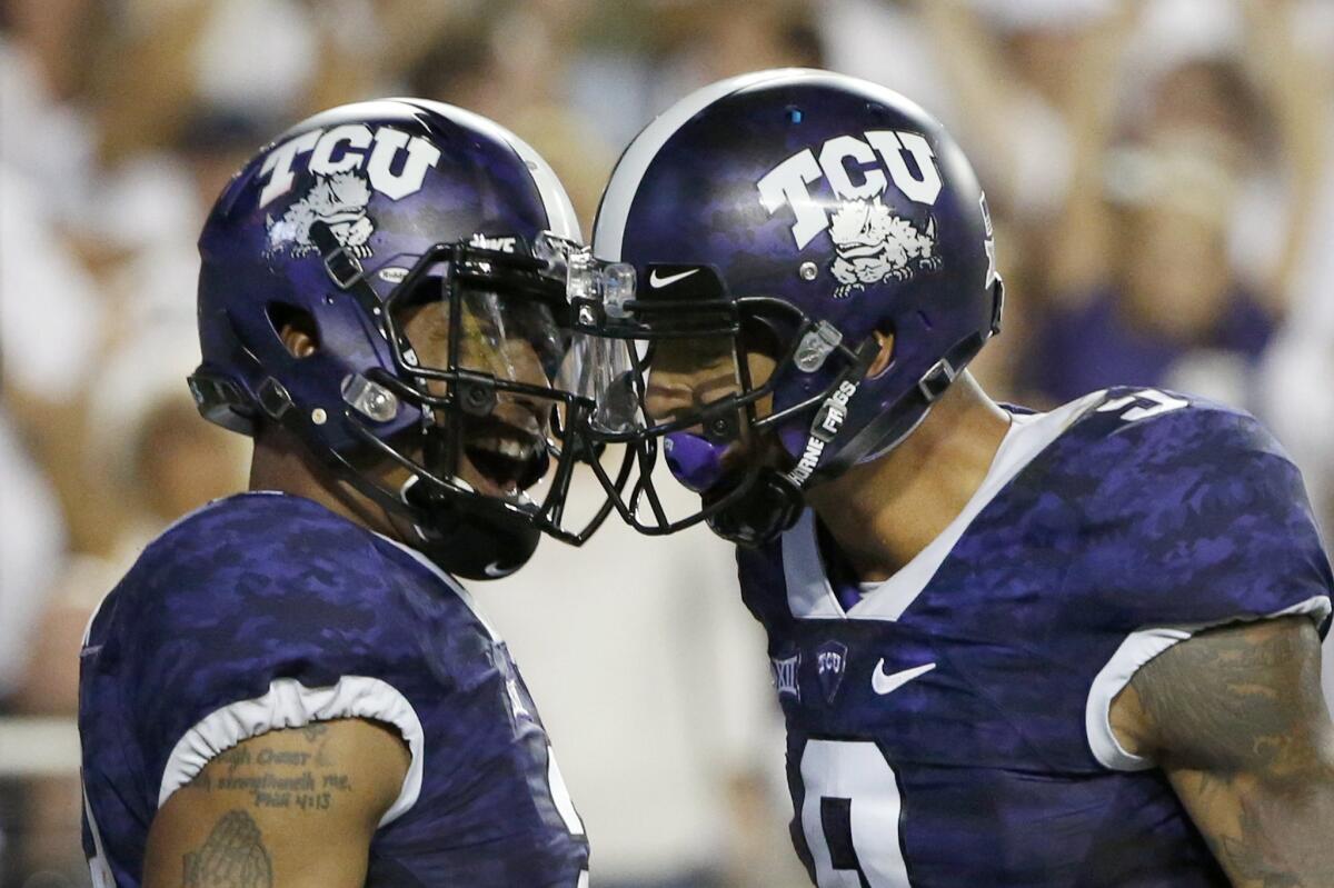 Texas Christian quarterback Trevone Boykin (2) celebrates with receiver Josh Doctson (9) after Boykin scored a touchdown against Southern Methodist on Sept. 19.