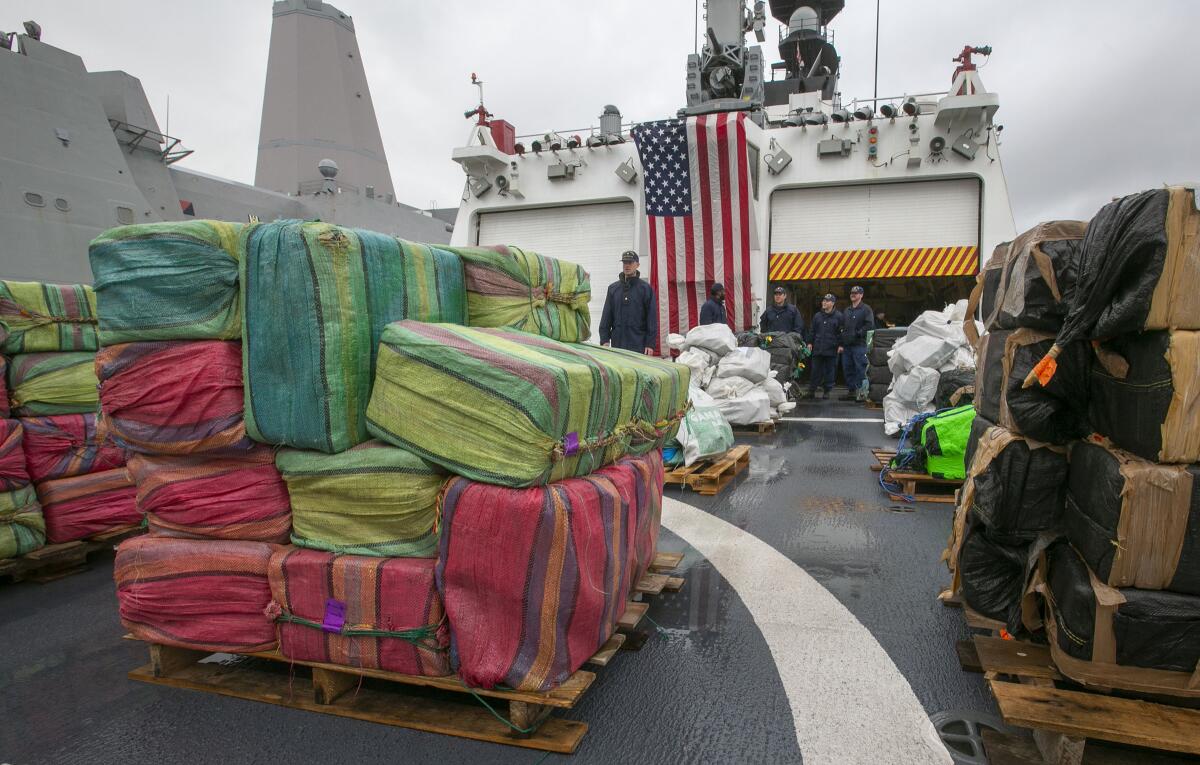 The crew of the Coast Guard cutter Munro offloads 20,000 pounds of uncut cocaine at Naval Base San Diego on Monday.