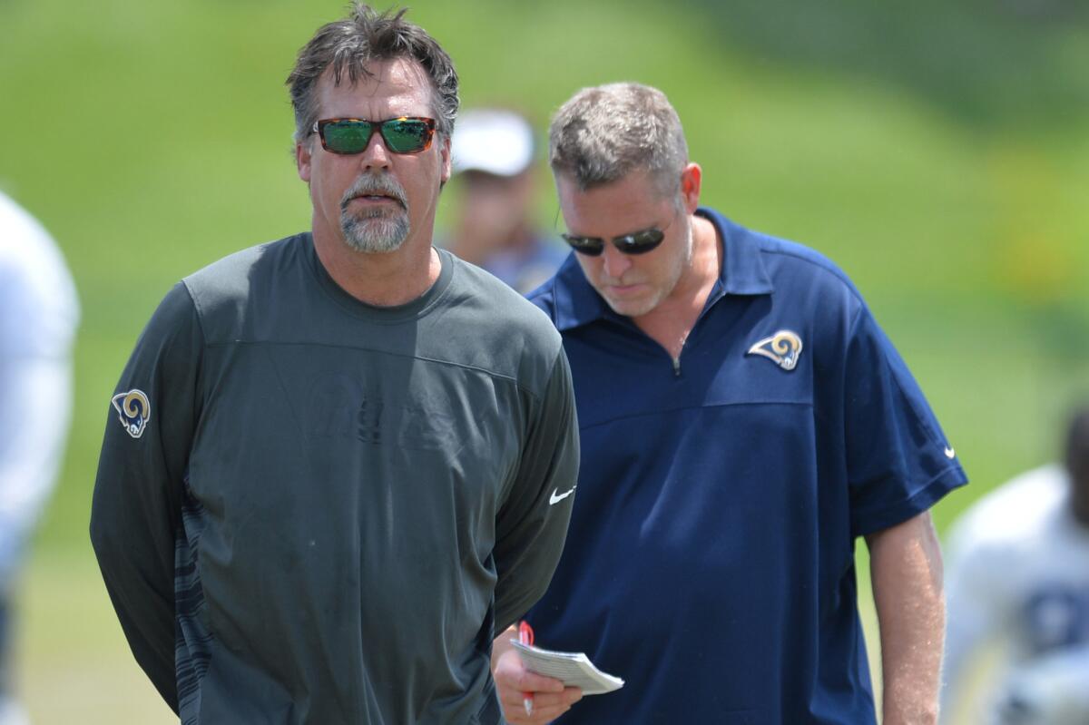 St. Louis Rams Coach Jeff Fisher looks on during a team practice on June 11. The Rams used a fifth-round pick on offensive tackle Isaiah Battle in the NFL Supplemental Draft on Thursday.