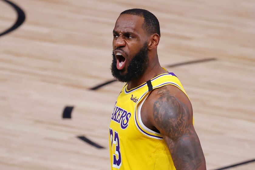Lakers star LeBron James reacts after a dunk during the third quarter against the Portland Trail Blazers in Game 2.