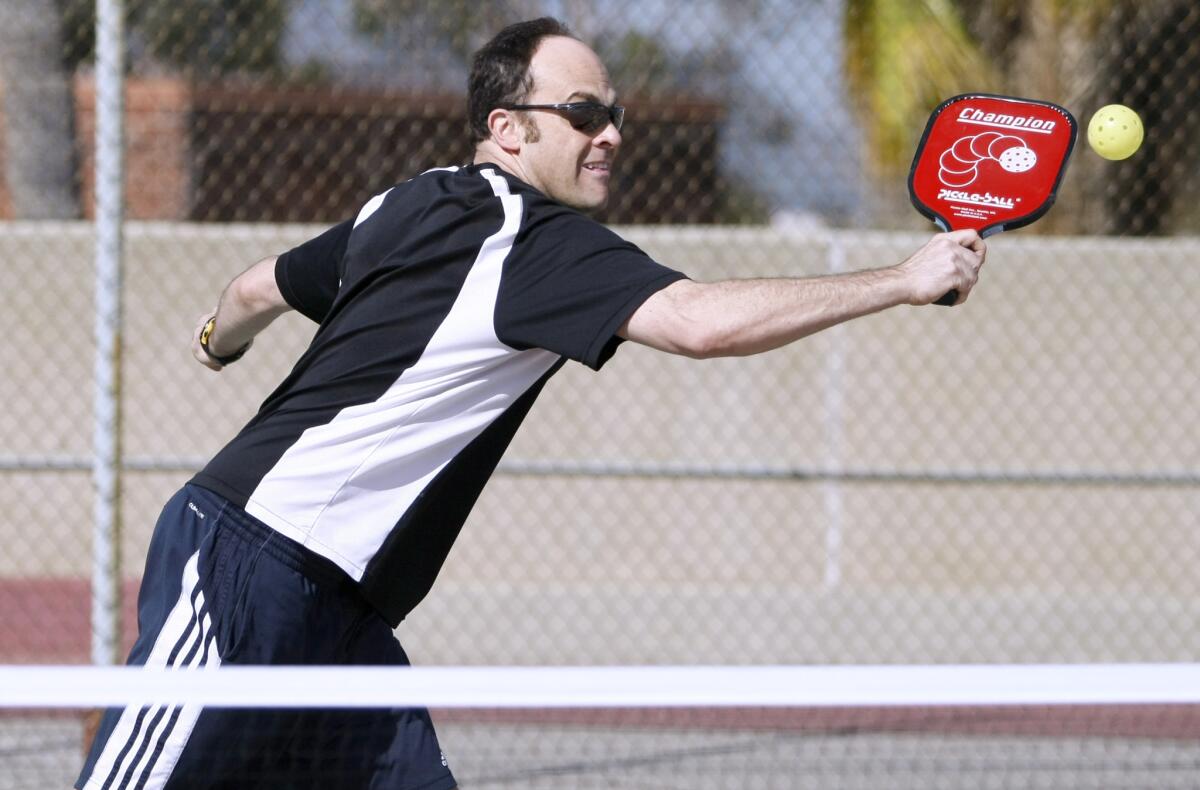 Eric Block plays pickelball at the Glendale YMCA on Thursday, March 13, 2014.